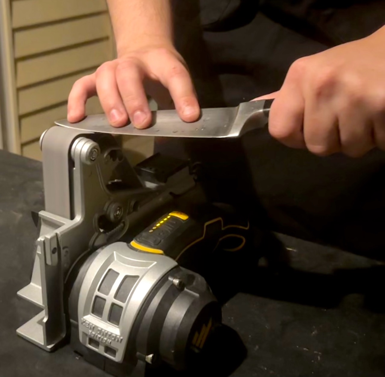 Close-up of a kitchen knife being sharpened