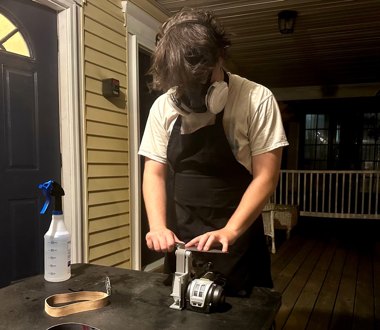 Red Bank Sharpening working on a knife at the sharpening station
